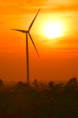 Wind turbines silhouette at sunset