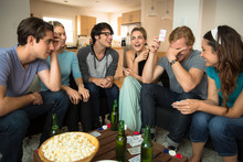 Young Group Of Friends Attractive People Laughing Embarrassed Poker Player Card Game Night Loser Winner