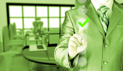 business man touching, pressing modern button with green ticking