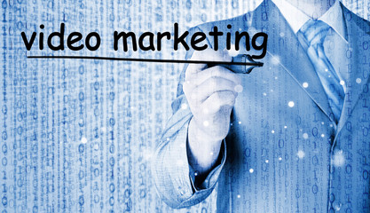 business man writing Video Marketing