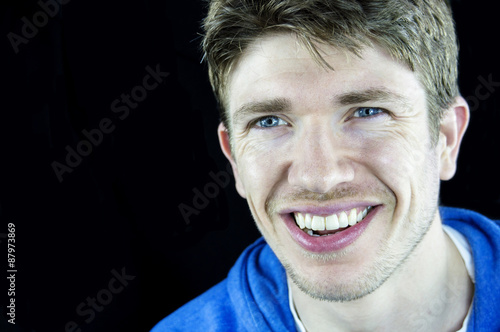 Headshot Of A Young Man With Blue Eyes Brown Hair And White