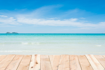 Wood terrace on beach blue sky