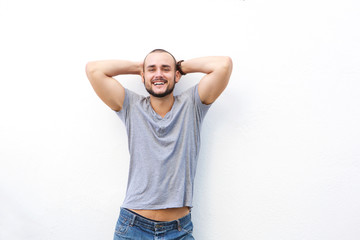 Sticker - Happy young man smiling with hands behind his head