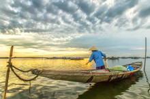 In Hue, Vietnam - June 21, 2015: A Man Ominous Morning Nets At Tam Giang Lagoon, Hue, Vietnam.