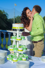 Wall Mural - Bride and groom cutting wedding cake