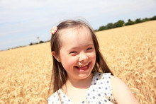 Young Girl Have Fun In The Wheat Field