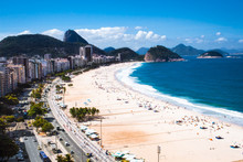 Copacabana Beach With City Skyline Of Rio De Janeiro, Brazil.