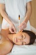 © WavebreakmediaMicro - Young woman getting an ear candling treatment