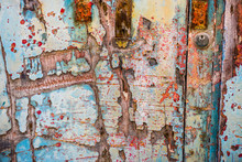 Old Wooden Door With Crumbling Paint
