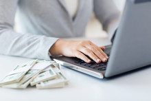 Close Up Of Woman Hands With Laptop And Money