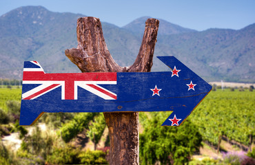 Wall Mural - New Zealand Flag wooden sign with winery background