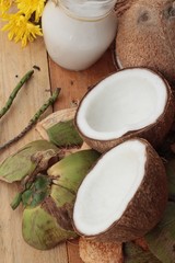 Sticker - white coconut and milk on wood background