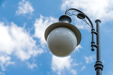 Wall Mural - Vintage Street Light Pole Against Blue Sky