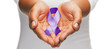 © Syda Productions - hands holding purple awareness ribbon
