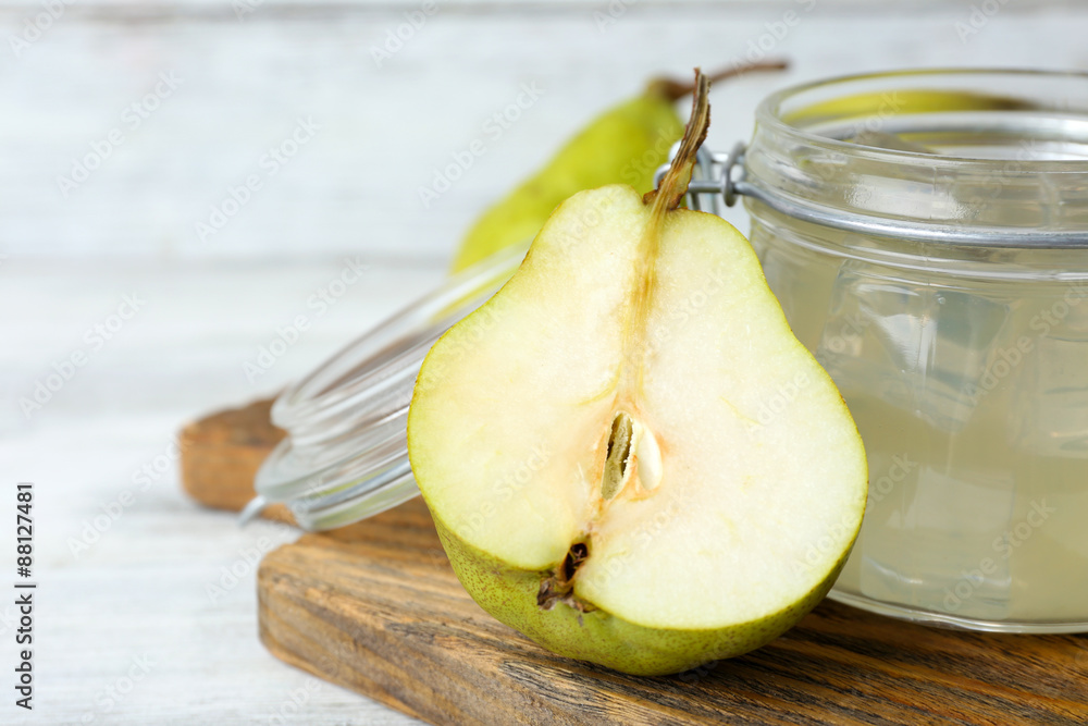 Pear juice with fresh fruit and cinnamon on table close up