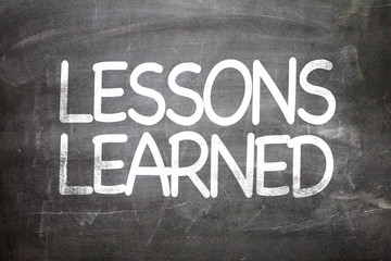 Wall Mural - Lessons Learned written on a chalkboard