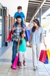 © WavebreakmediaMicro - Happy family having fun in the mall