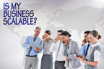 Composite image of business team all talking on phone