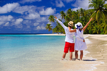 happy loving couple on tropical beach