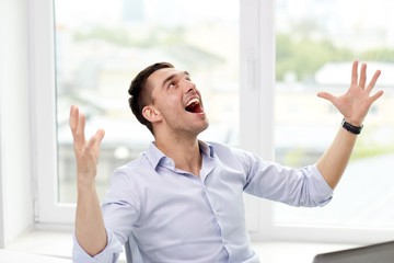 Sticker - happy businessman with laptop in office