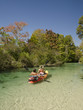 Woman kayaking on the Weeki Wachee River, Spring Hill Florida. 
