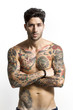 © patronestaff - Handsome tattooed man portrait with crossed arms