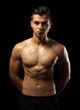 © Africa Studio - Muscle young man on dark background