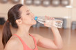 © Viacheslav Yakobchuk - Young sportswoman drinking water after training