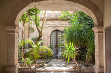 Courtyard Of An Old Baroque Palace And Plants In The Old Syracuse
