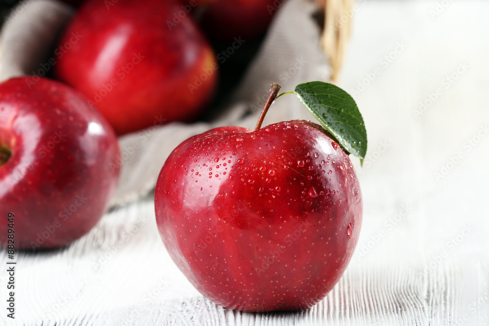 Ripe red apples on table close up