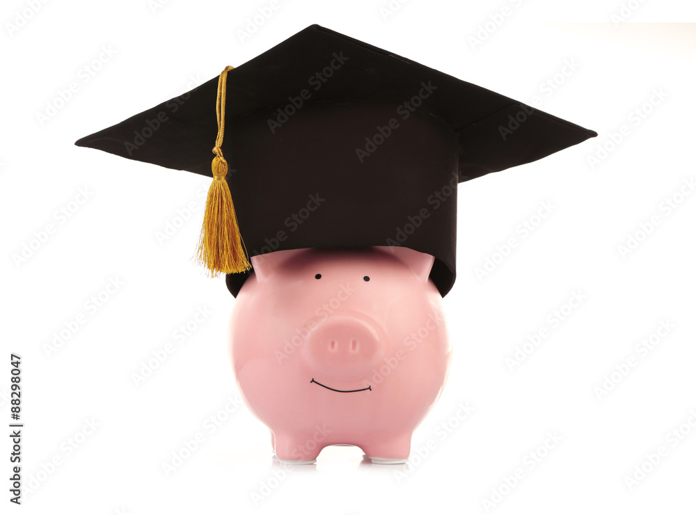 Pink piggy bank with Graduation hat isolated on white