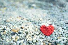 Heart Shaped Stone On The Sand