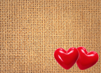 Linen texture background with two red hearts