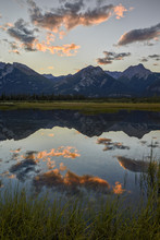 Orange Clouds At Sunset Reflected In A Lake, Jasper National Park, Alberta, Rocky Mountains, Canada