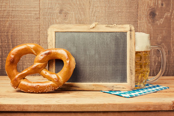 Wall Mural - Chalkboard, pretzel and beer glass for Oktoberfest celebration