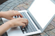 © jannoon028 - Closeup of business woman hand typing on laptop keyboard