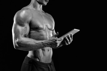 Muscular man in dark background