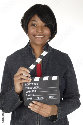 Fotografie, Obraz An attractive young woman holds an open film slate.