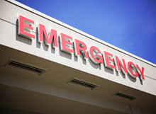The Front Entrance Sign To An Emergency Room Department In A Cit