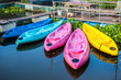 © saksuvan - Kayaks in river Colorful plastic boat..
