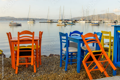 Traditional Bright Colored Chairs In Cycladic Style On The Beach