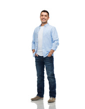 Smiling Man With Hands In Pockets