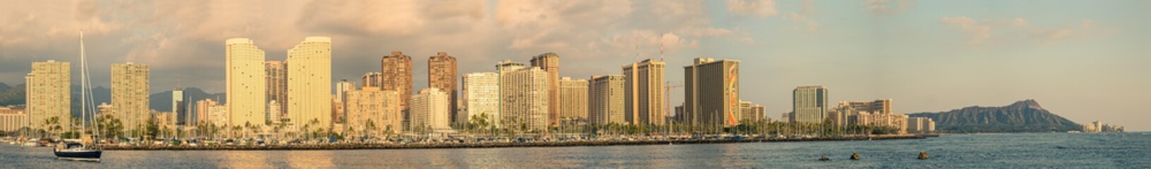 A panorama view of Waikiki and Diamond Head on Oahu, Hawaii, as the sun is setting