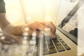 Close up of business man hand working on laptop computer with so