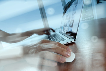 double exposure of business man hand working on laptop computer