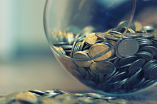 Coins In A Piggy Bank Vase