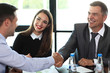 © opolja - Business people shaking hands, finishing up a meeting