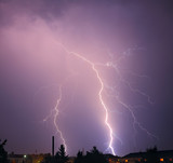 Fototapeta Tęcza - Lightning over the city