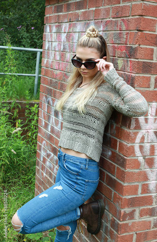 Photo  tough looking teenage girl with her nose pierced