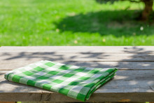 Empty Wooden Garden Table With Tablecloth